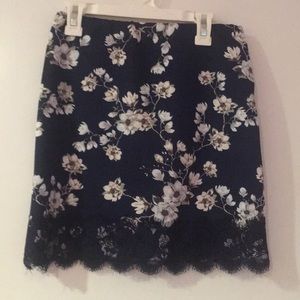 Navy blue skirt with flowers.